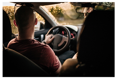 image of a man driving enjoying scenery